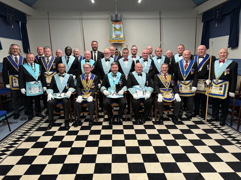 The Brethren of Plumstead Lodge gathered beneath the lodge banner